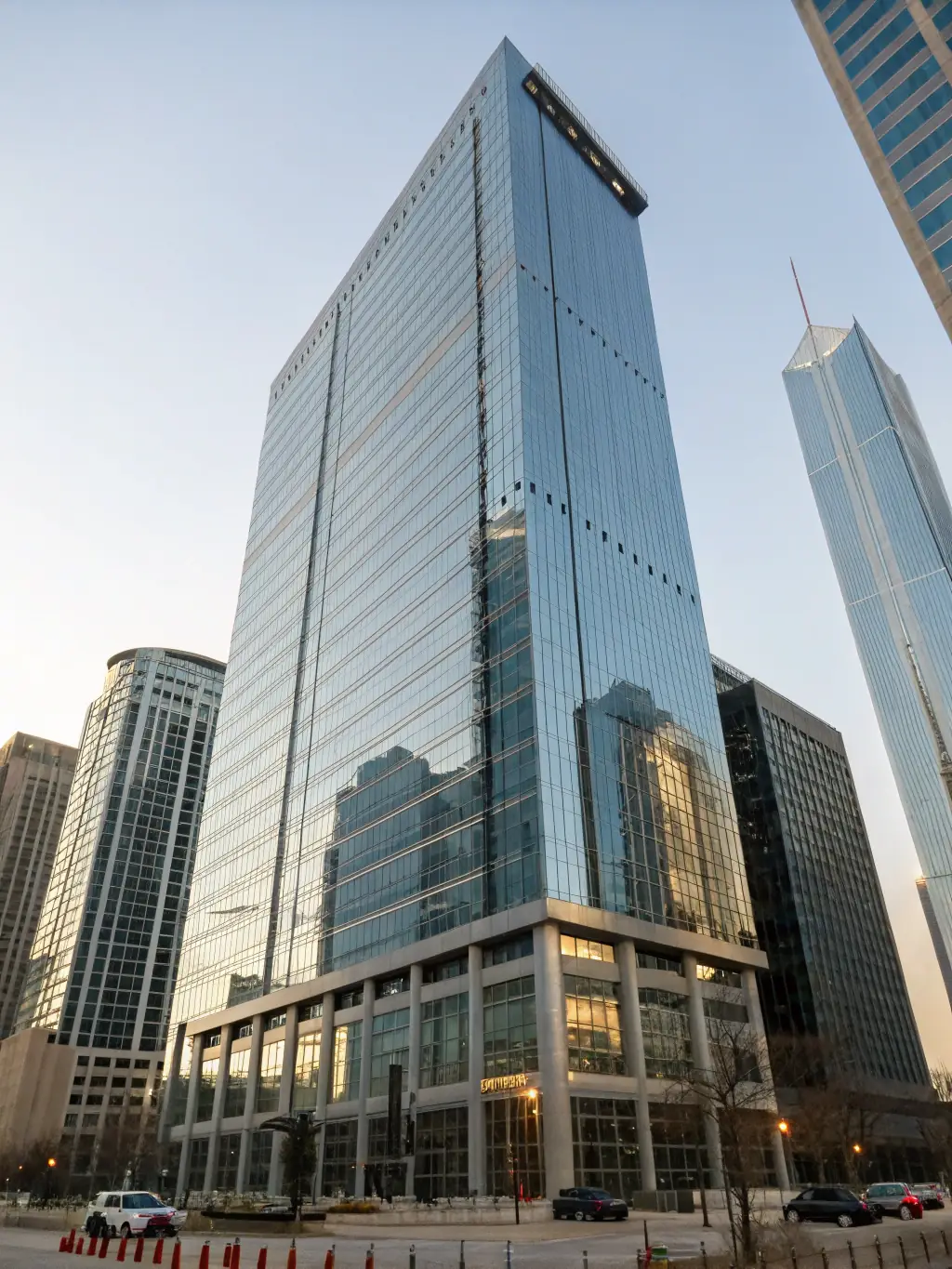 A modern office building with a focus on architectural design, representing the real estate industry.