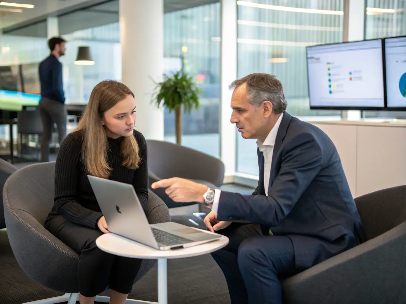 A consultant reviewing operational workflows with a client in a modern conference room, emphasizing efficiency and collaboration.